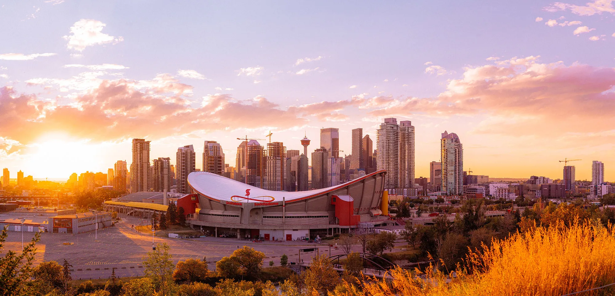 Calgary skyline and the Saddledome at sunset
